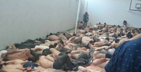 Gözaltına alınan askerler yarı çıplak spor salonunda